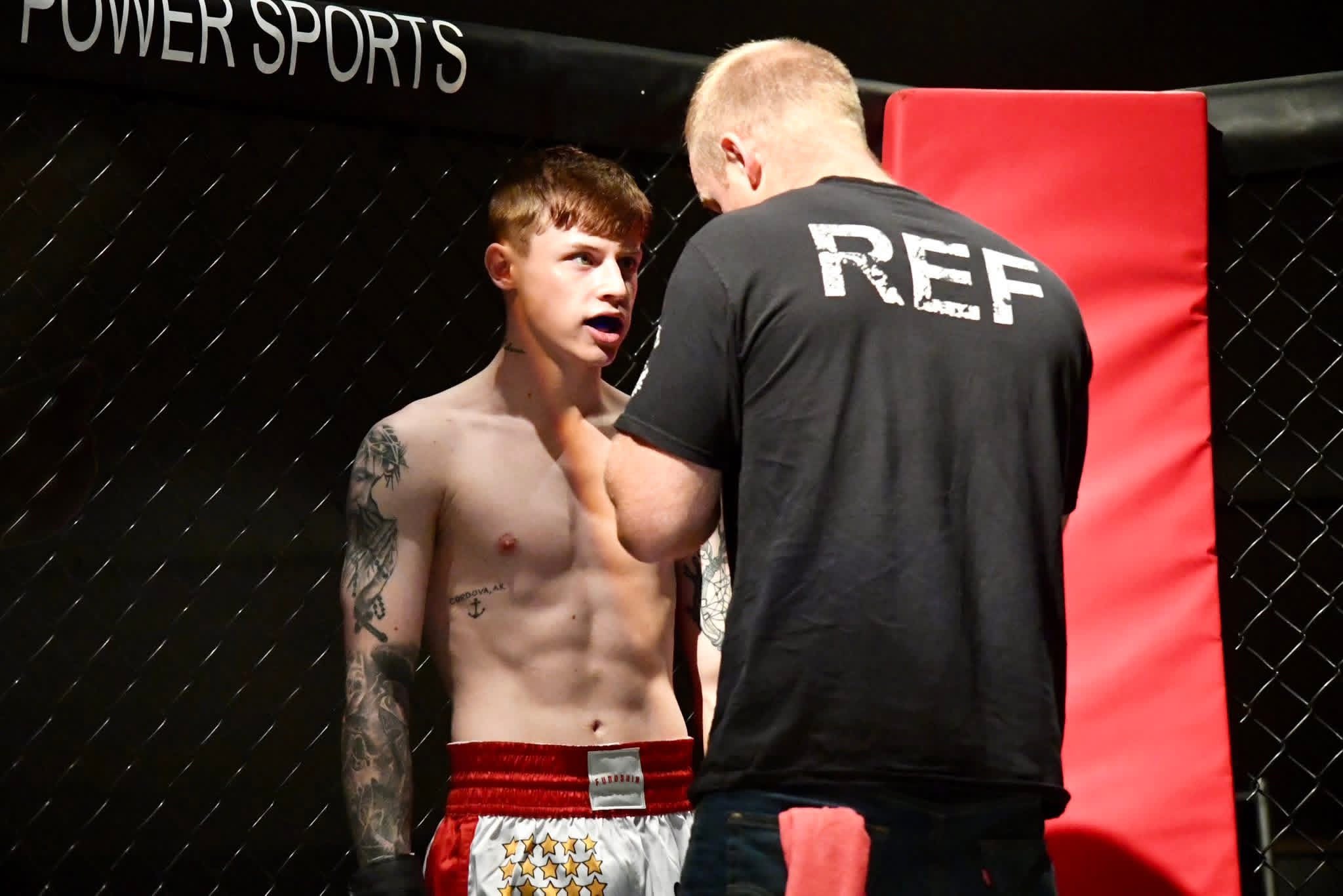 Referee instructing fighters